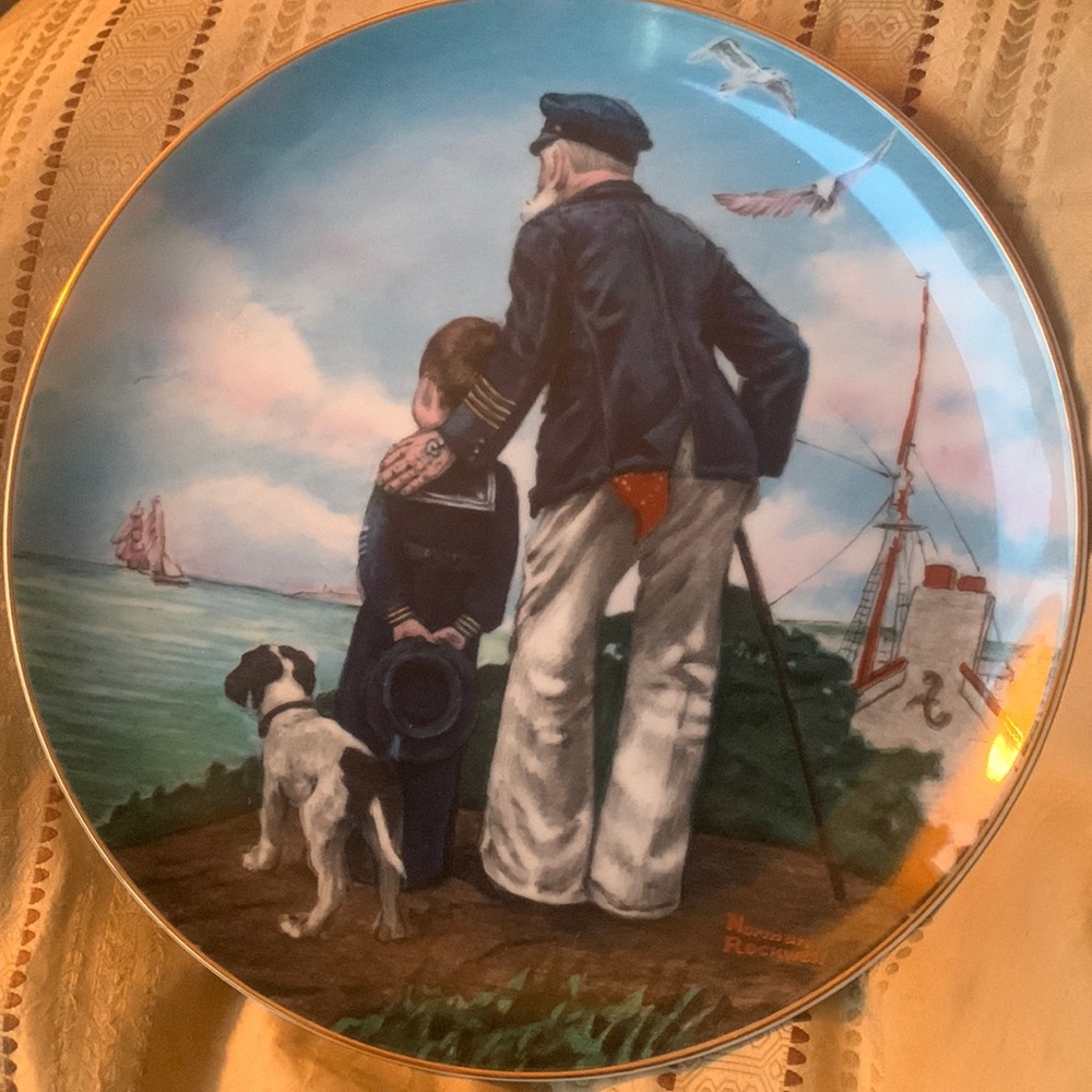Beautiful Norman rockwell plate. “Looking out yo sea”gold trim. Like new